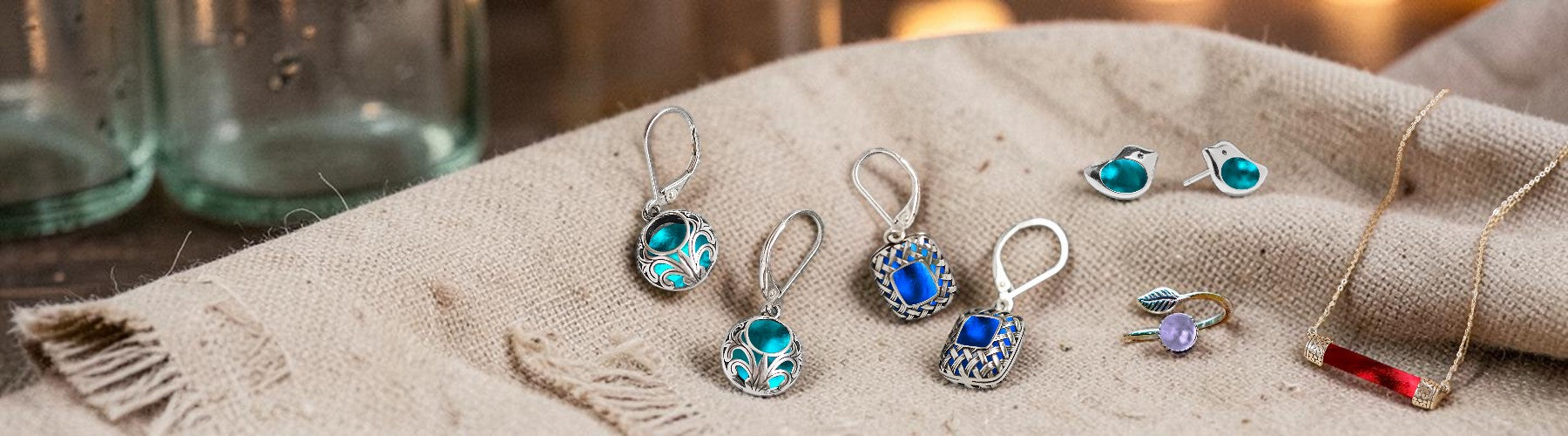 Set of earrings with gemstones on a textured fabric surface